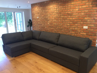 Armless sofa opening up the room