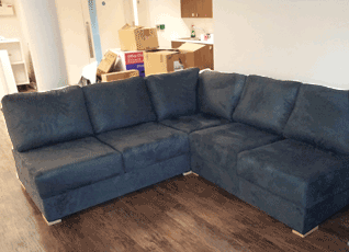 A corner sofa splitting the room
